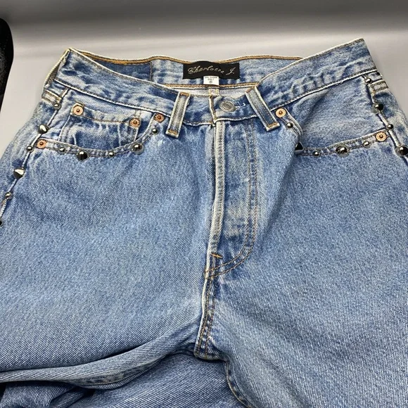 Vintage Levi’s redesign by Charlotte f with real feather detail o de legs sides